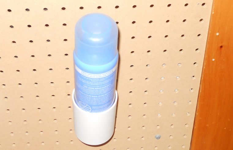 Spray can holder for pegboard